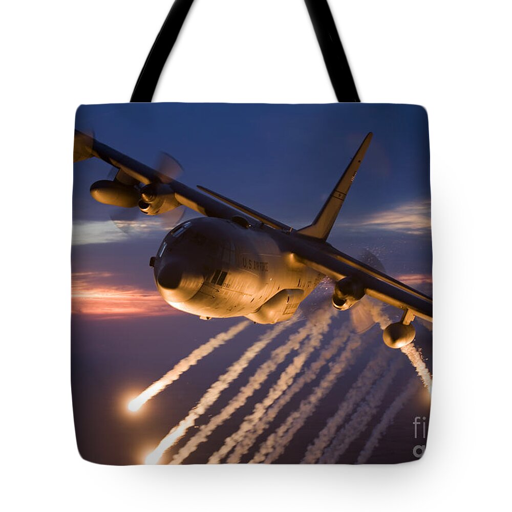 Smoke Tote Bag featuring the photograph A C-130 Hercules Releases Flares #1 by HIGH-G Productions