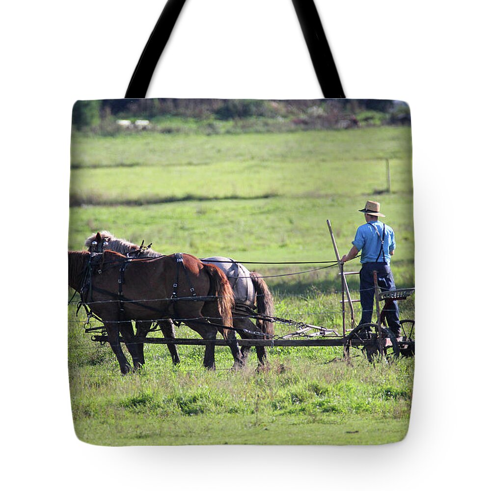 Amish Tote Bag featuring the photograph Amish Spreading Manure #1 by Brook Burling