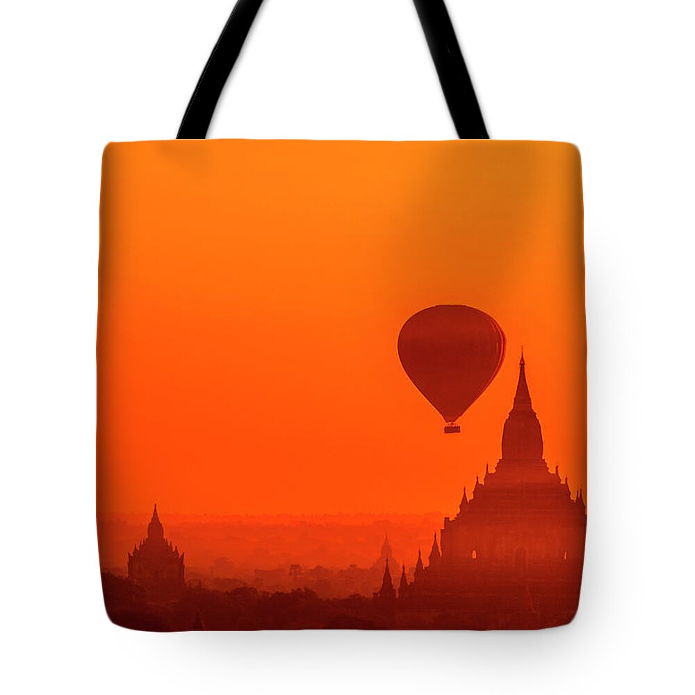 Travel Tote Bag featuring the photograph Bagan pagodas and hot air balloon #1 by Pradeep Raja Prints