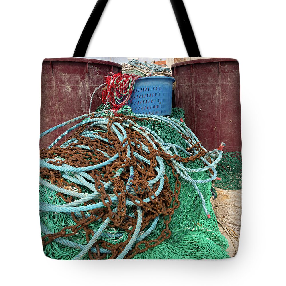 Closeup of a green fishing net, rusty chain and vats #1 Tote Bag