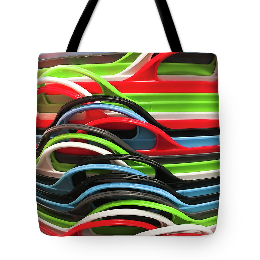 Abstract Tote Bag featuring the photograph Colourful plastic containers #1 by Tom Gowanlock