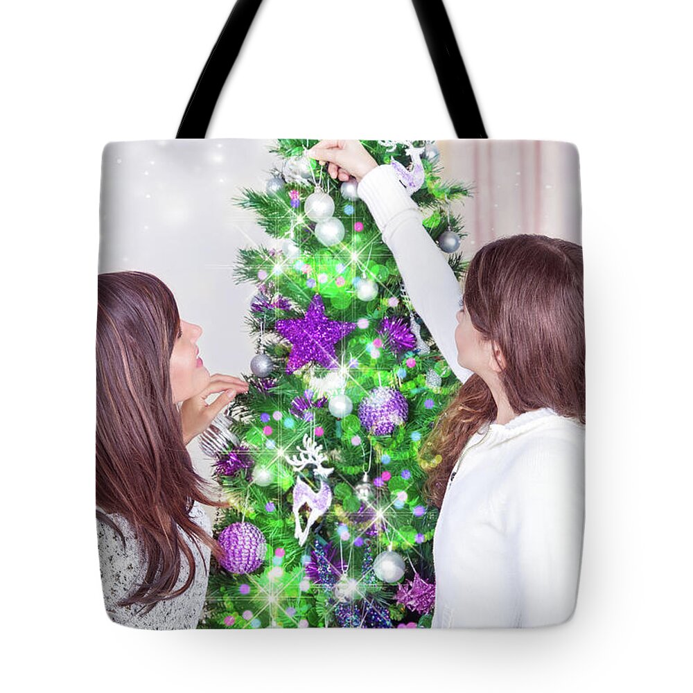 Beautiful Tote Bag featuring the photograph Decorating Christmas tree #1 by Anna Om