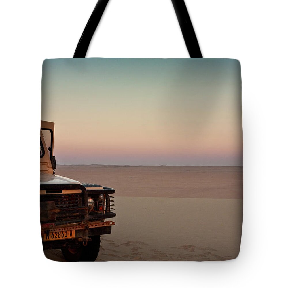 Africa Tote Bag featuring the photograph Drive to the edge of sundown #1 by Sylvia J Zarco