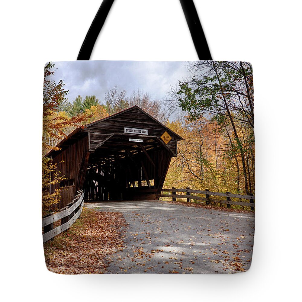 #jefffolger Tote Bag featuring the photograph Fall colors over the Durgin Covered Bridge #1 by Jeff Folger