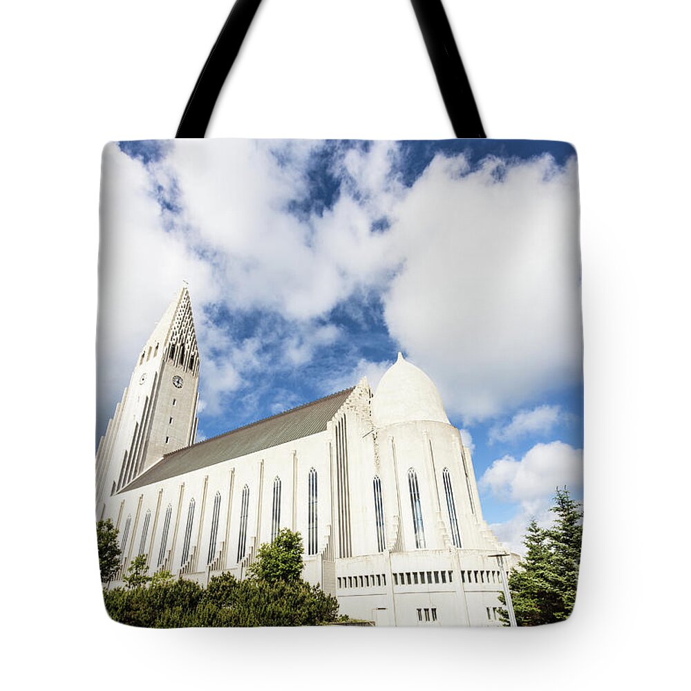 Capital Cities Tote Bag featuring the photograph Hallgrimskirkja church in Reykjavik #1 by Didier Marti
