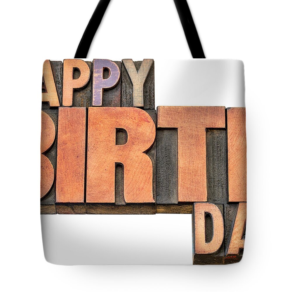 Banner Tote Bag featuring the photograph Happy Birthday word abstract in wood type #1 by Marek Uliasz