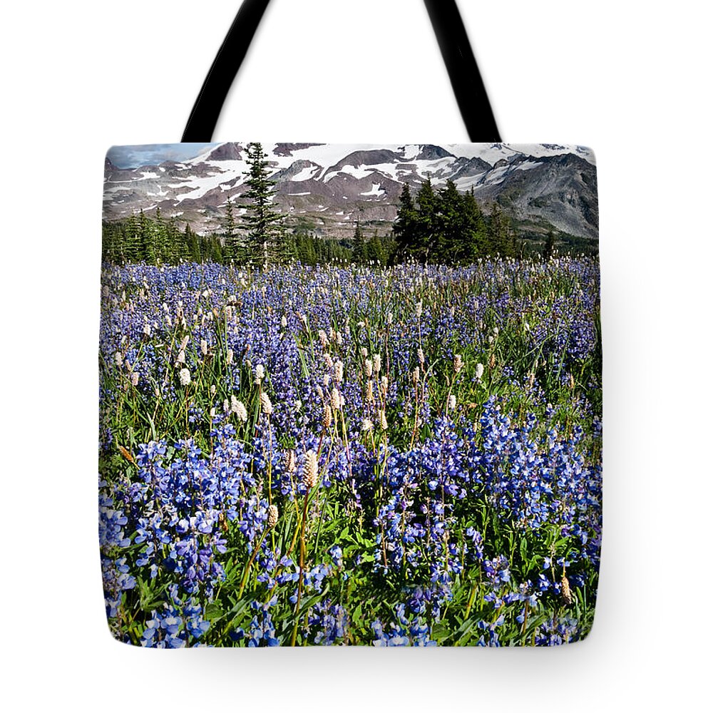 Alpine Tote Bag featuring the photograph Meadow of Lupine Near Mount Rainier by Jeff Goulden