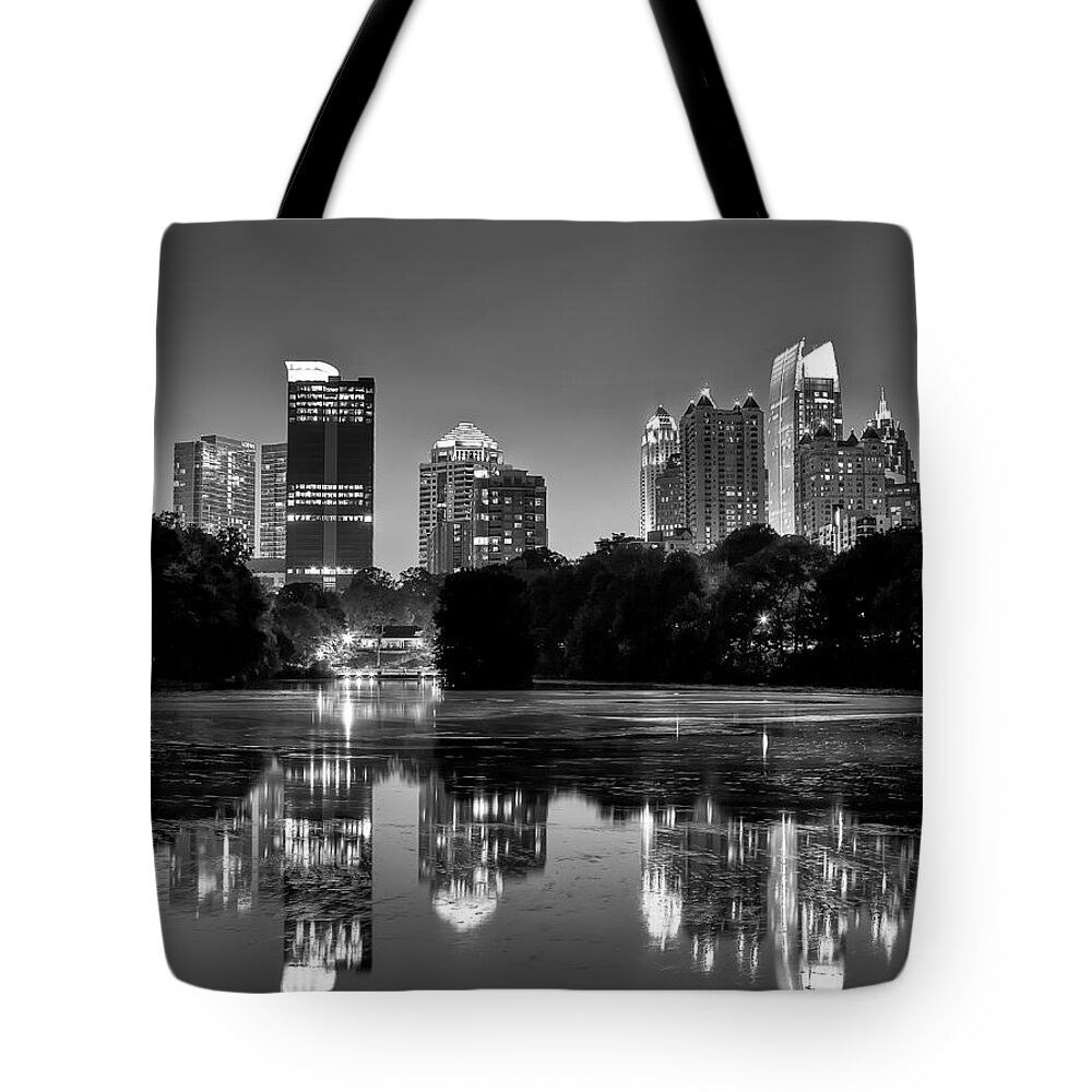 Night Tote Bag featuring the photograph Night Atlanta.Piedmont Park lake. by Anna Rumiantseva