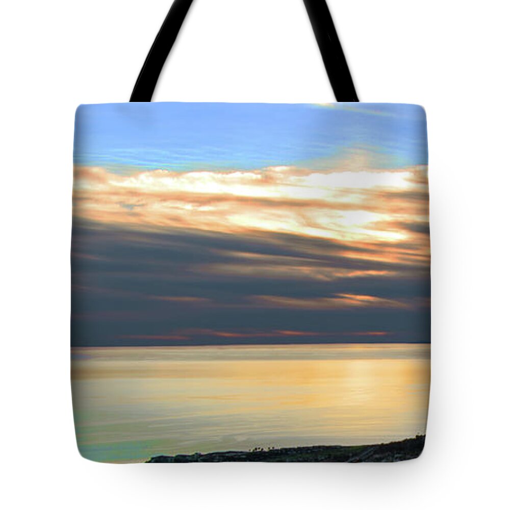Sunset Tote Bag featuring the photograph Ominous Sunset by Ed Clark