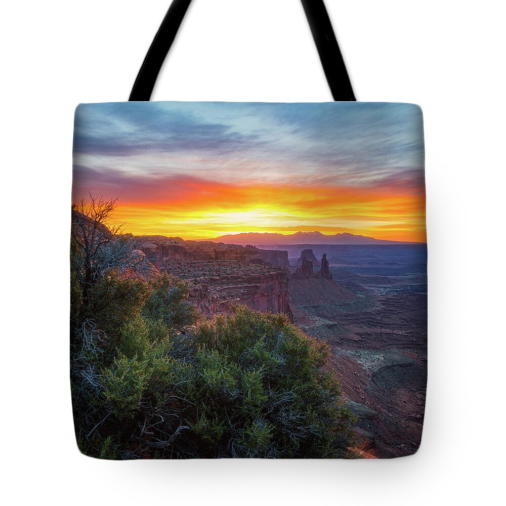 Sunrise Tote Bag featuring the photograph Sunrise over Canyonlands by Darren White