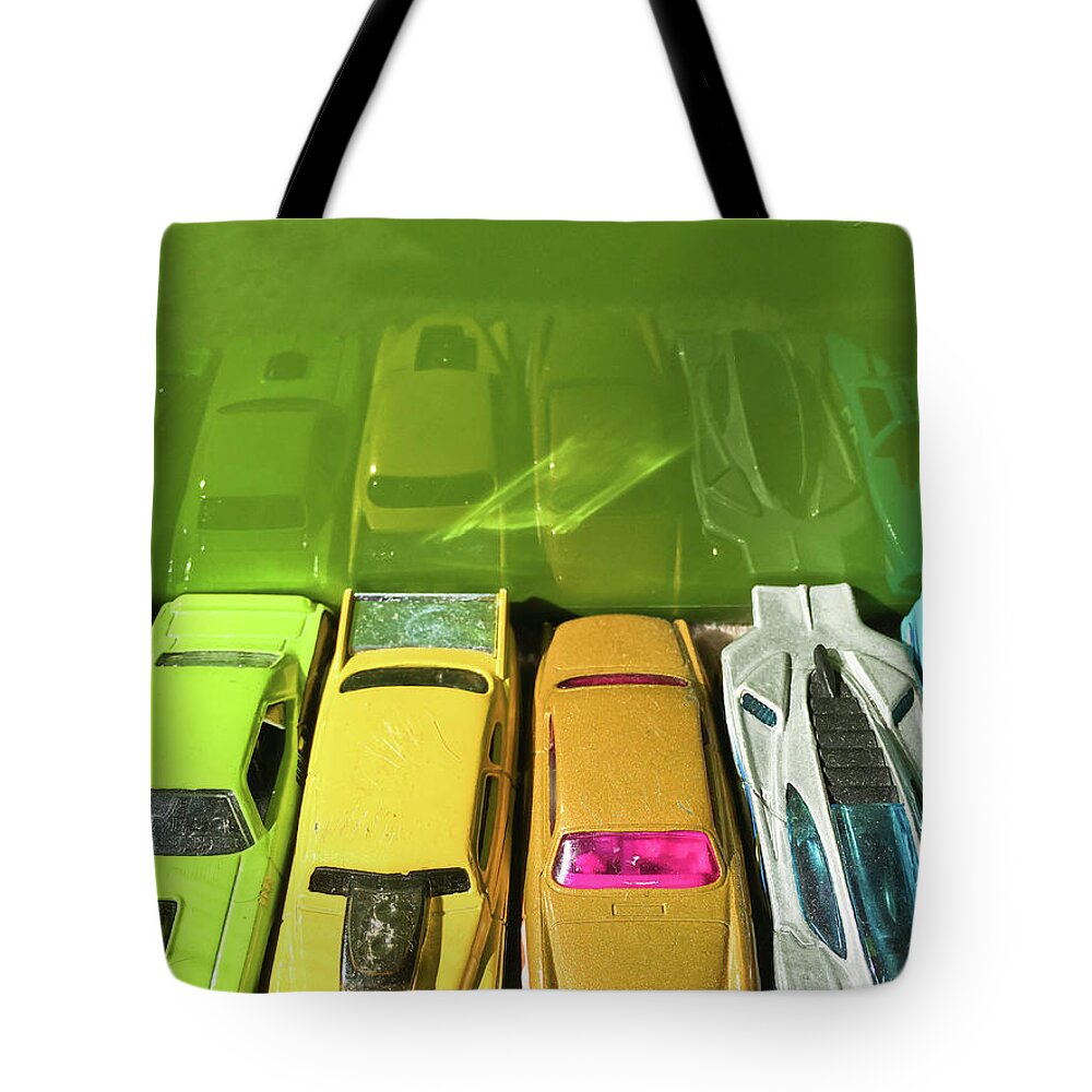 Antique Tote Bag featuring the photograph Toy cars #1 by Tom Gowanlock
