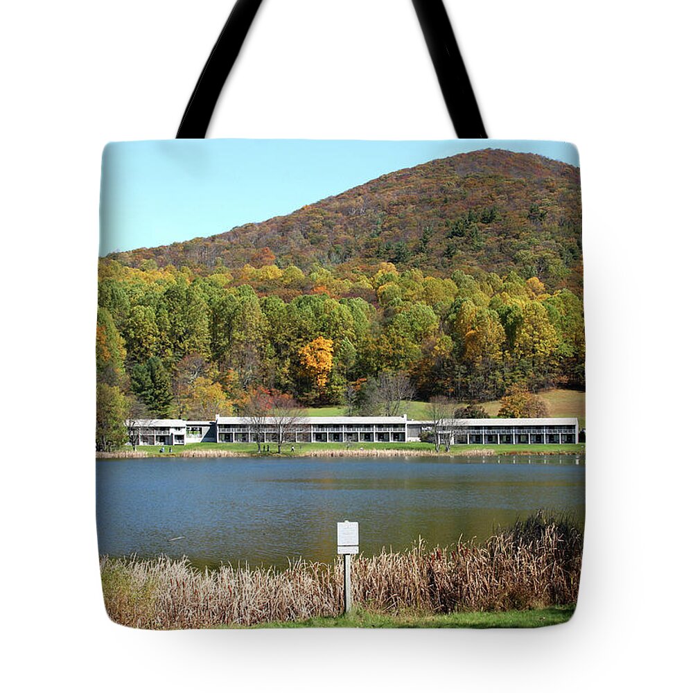 Lake Tote Bag featuring the photograph View of Peaks of Otter lodge and Abbott Lake in autumn #1 by Emanuel Tanjala