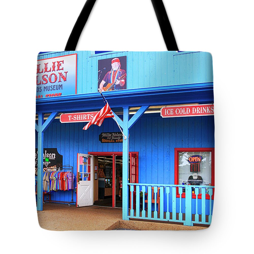 Willie Nelson Tote Bag featuring the photograph Willie Nelson and Friends Museum and souvenir store in Nashville, TN, USA #1 by Chris Smith