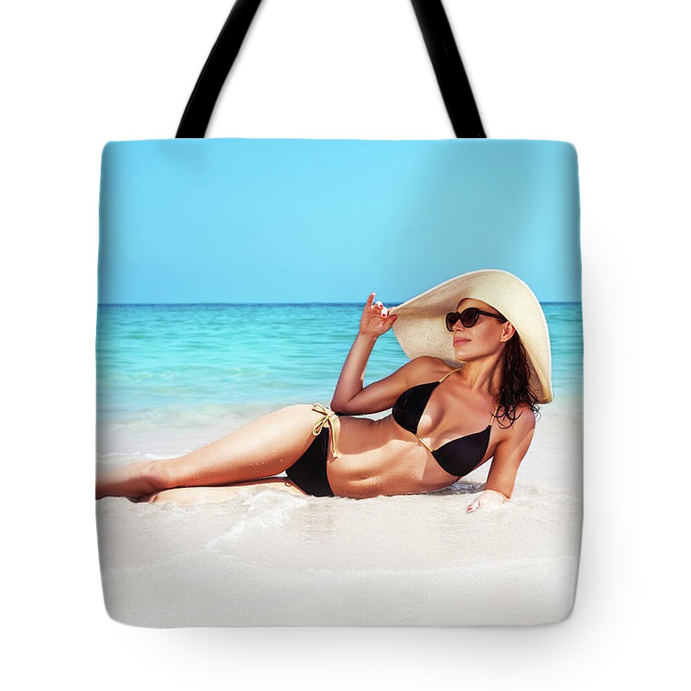 Beach Tote Bag featuring the photograph Beautiful woman on the beach by Anna Om