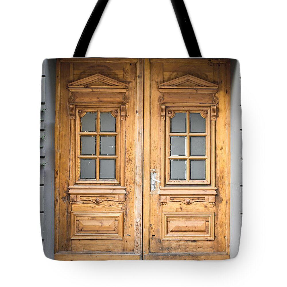 Aged Tote Bag featuring the photograph Wooden door #19 by Tom Gowanlock