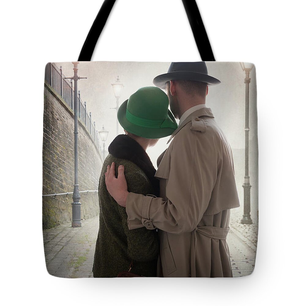 1940s Tote Bag featuring the photograph 1940s Couple At Dusk by Lee Avison