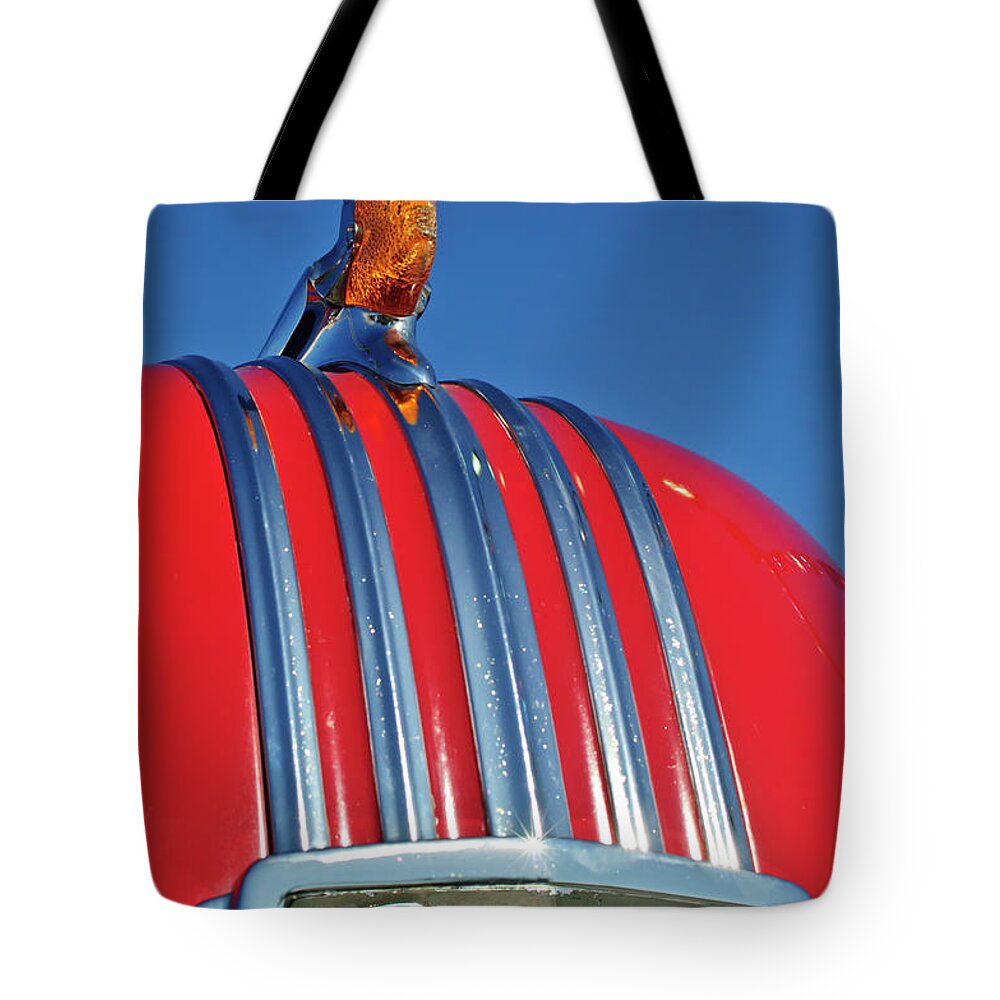 1951 Pontiac Chief Tote Bag featuring the photograph 1951 Pontiac Chief Hood Ornament 2 by Jill Reger