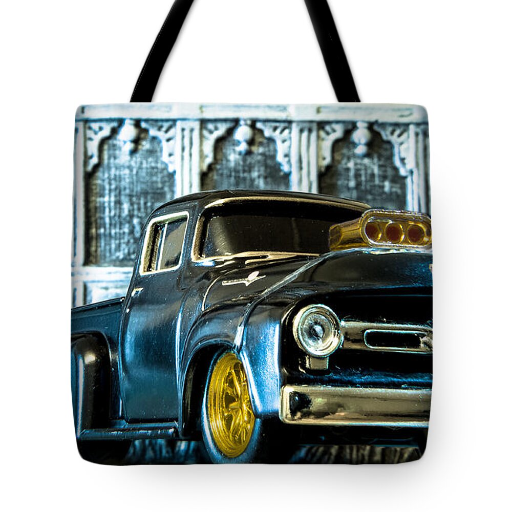   Hotwheels Tote Bag featuring the photograph Miniature Marvel Capturing the Essence of a 1956 Ford F-100 by Gregg Ott