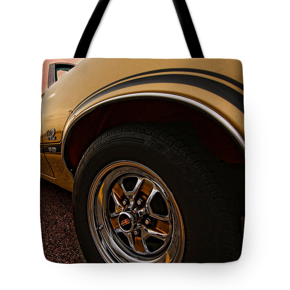 Oldsmobile Tote Bag featuring the photograph 1970 Oldsmobile Cutlass 4-4-2 W-30 by Gordon Dean II