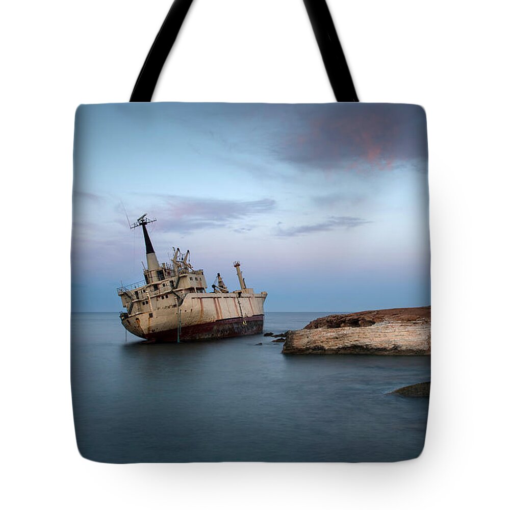 Ship Tote Bag featuring the photograph Abandoned Ship on a rocky coast #1 by Michalakis Ppalis