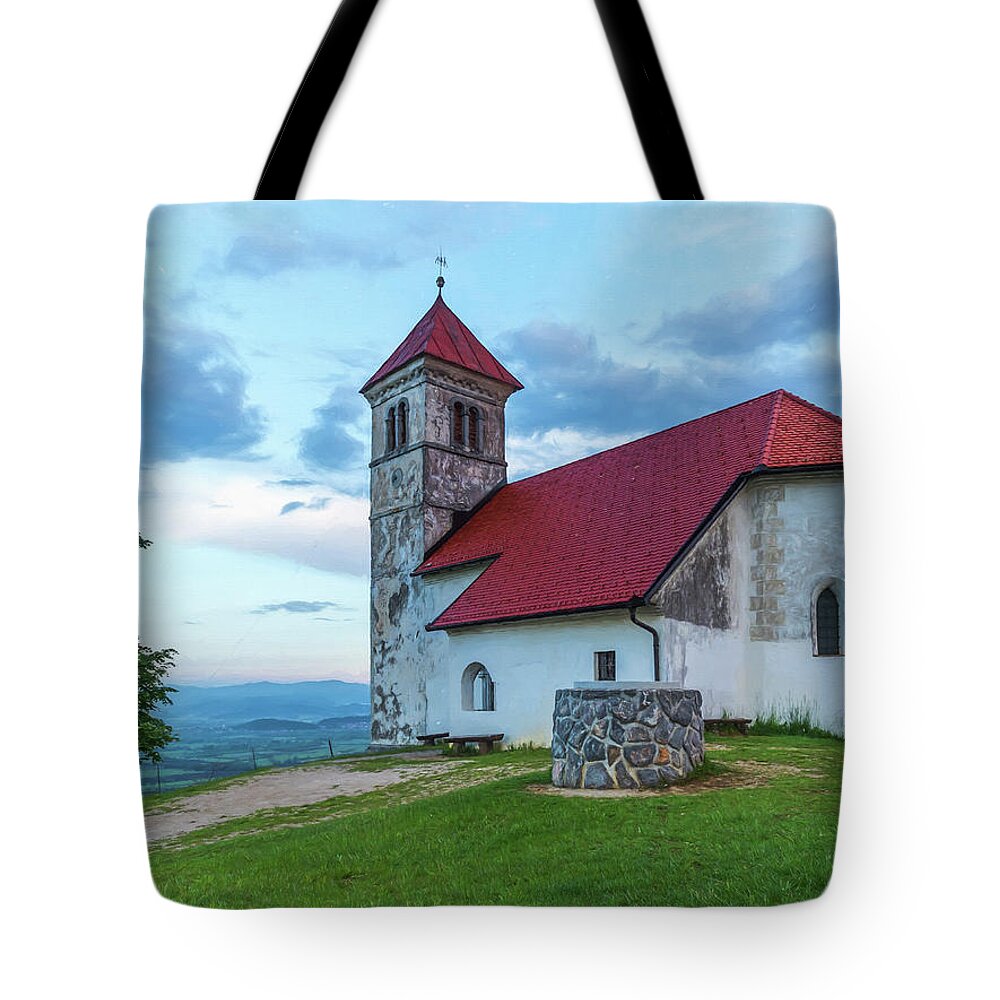 Europe Tote Bag featuring the photograph A red roof church in Ljubjliana. by Usha Peddamatham