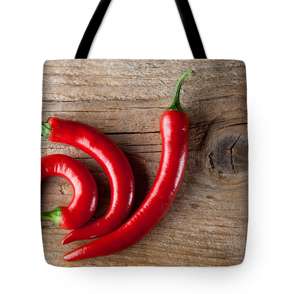 Chili Tote Bag featuring the photograph Red Chili Pepper by Nailia Schwarz