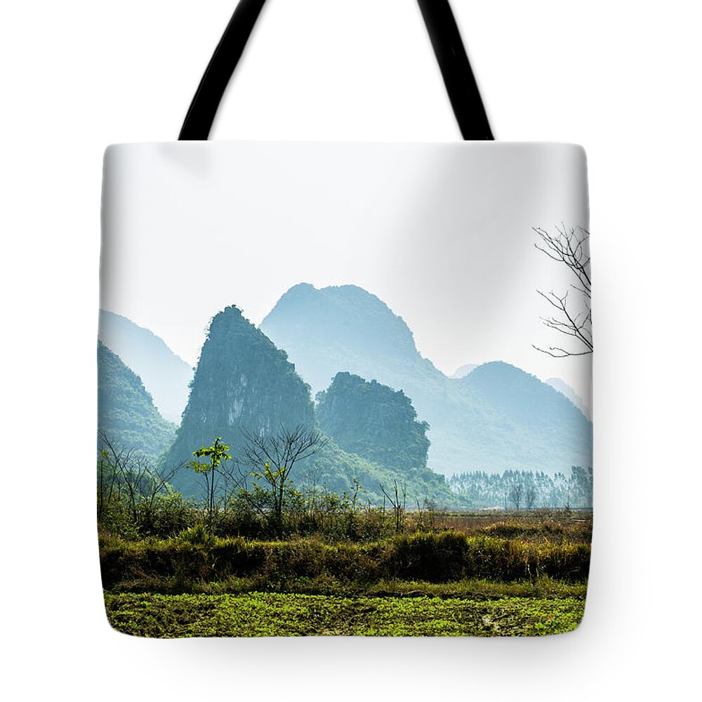 Countryside Tote Bag featuring the photograph Countryside scenery in the mist #3 by Carl Ning