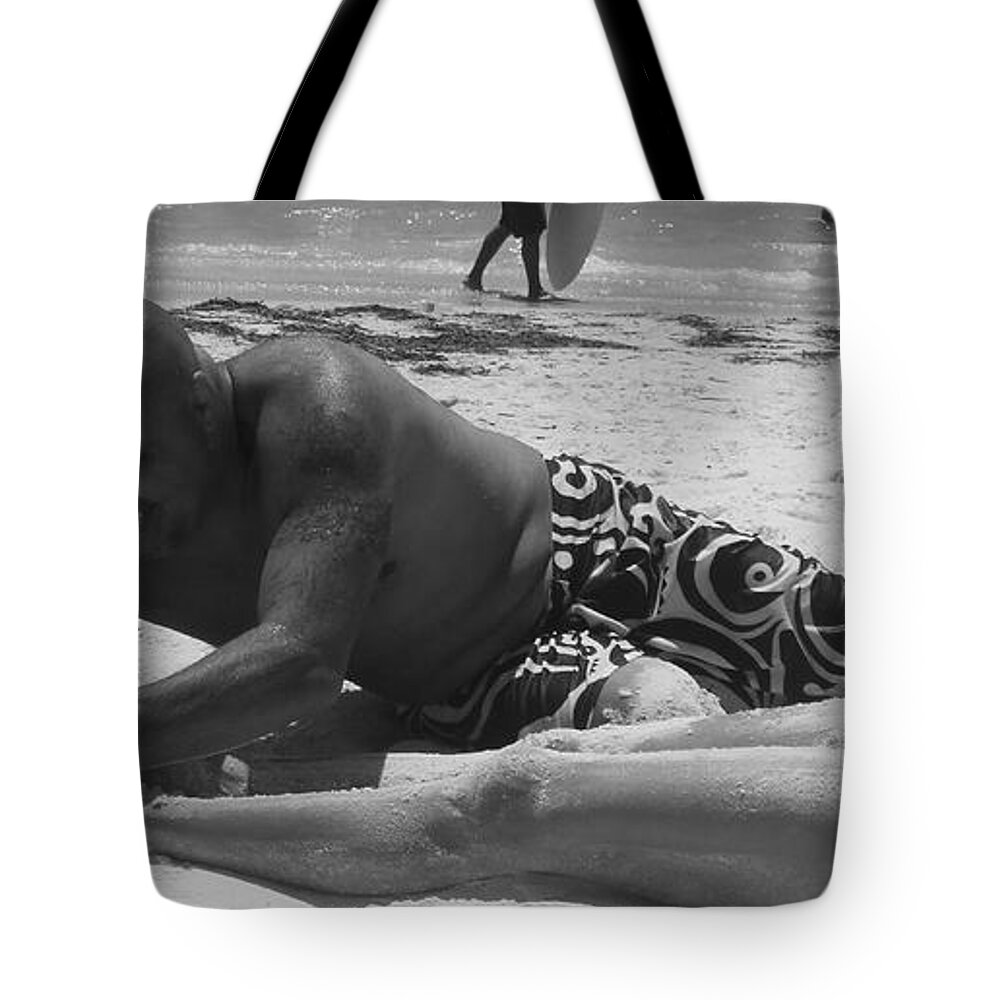 Beach Tote Bag featuring the photograph 3 Dollar Sand Rub Down by WaLdEmAr BoRrErO