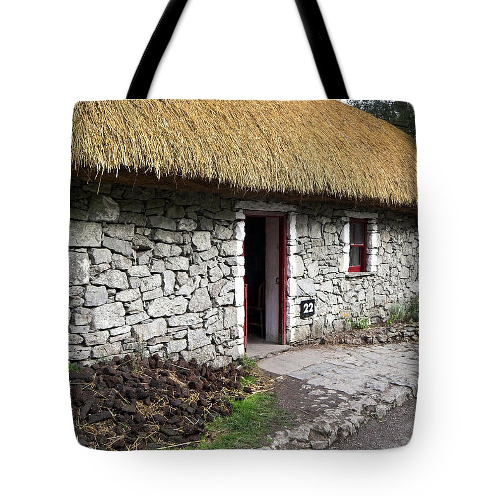 Thatch Roof Tote Bag featuring the photograph Traditional Thatch roof cottage Ireland #3 by Pierre Leclerc Photography