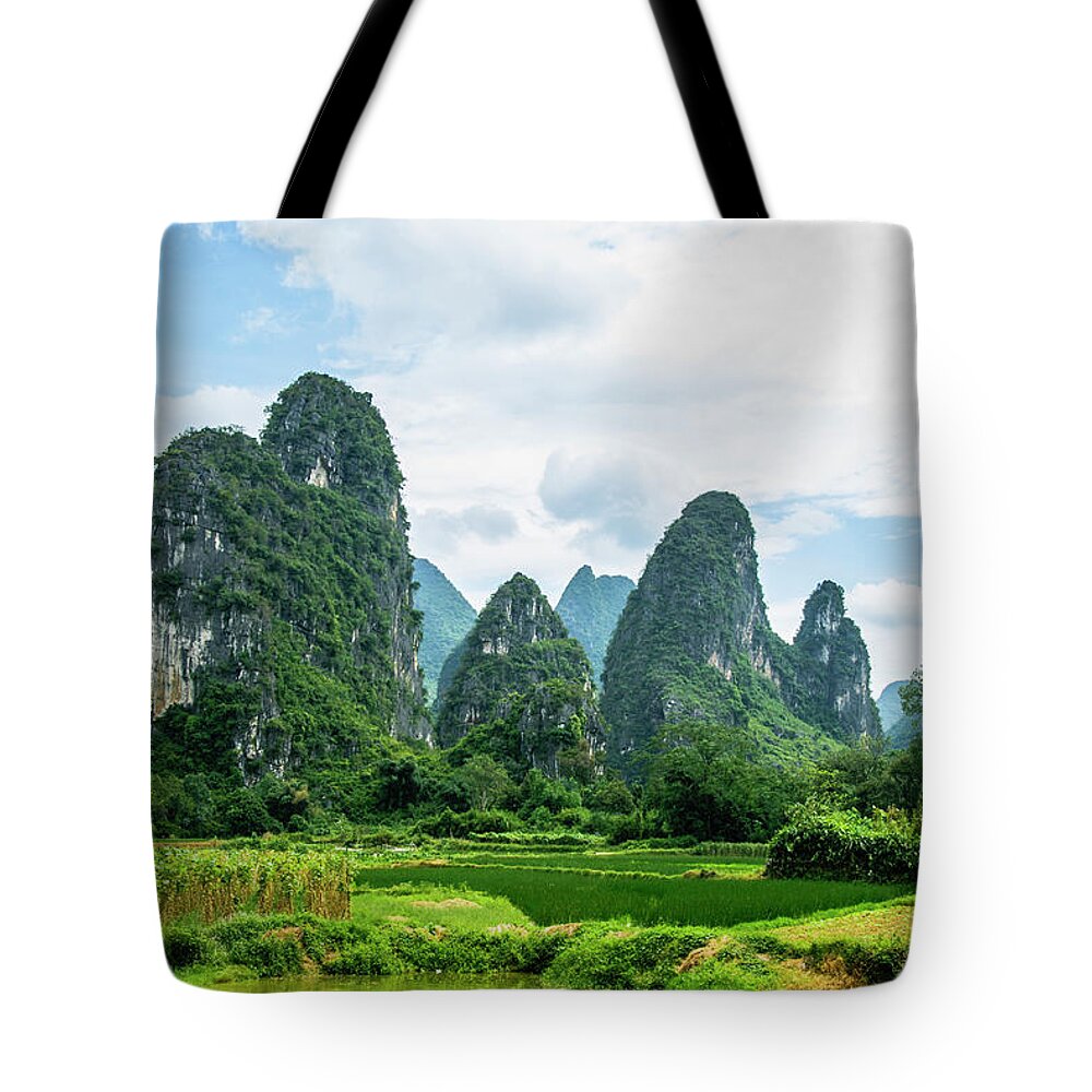 Karst Tote Bag featuring the photograph Karst mountains and rural scenery #47 by Carl Ning