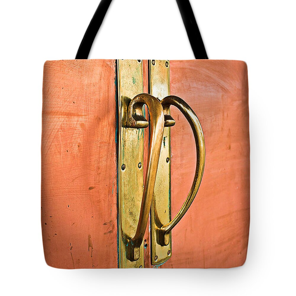 Antique Tote Bag featuring the photograph Door handle #7 by Tom Gowanlock