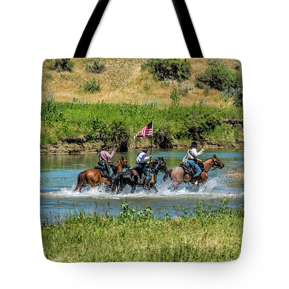 Little Bighorn Re-enactment Tote Bag featuring the photograph 7th Cavalry Riding Across Little Bighorn River by Donald Pash