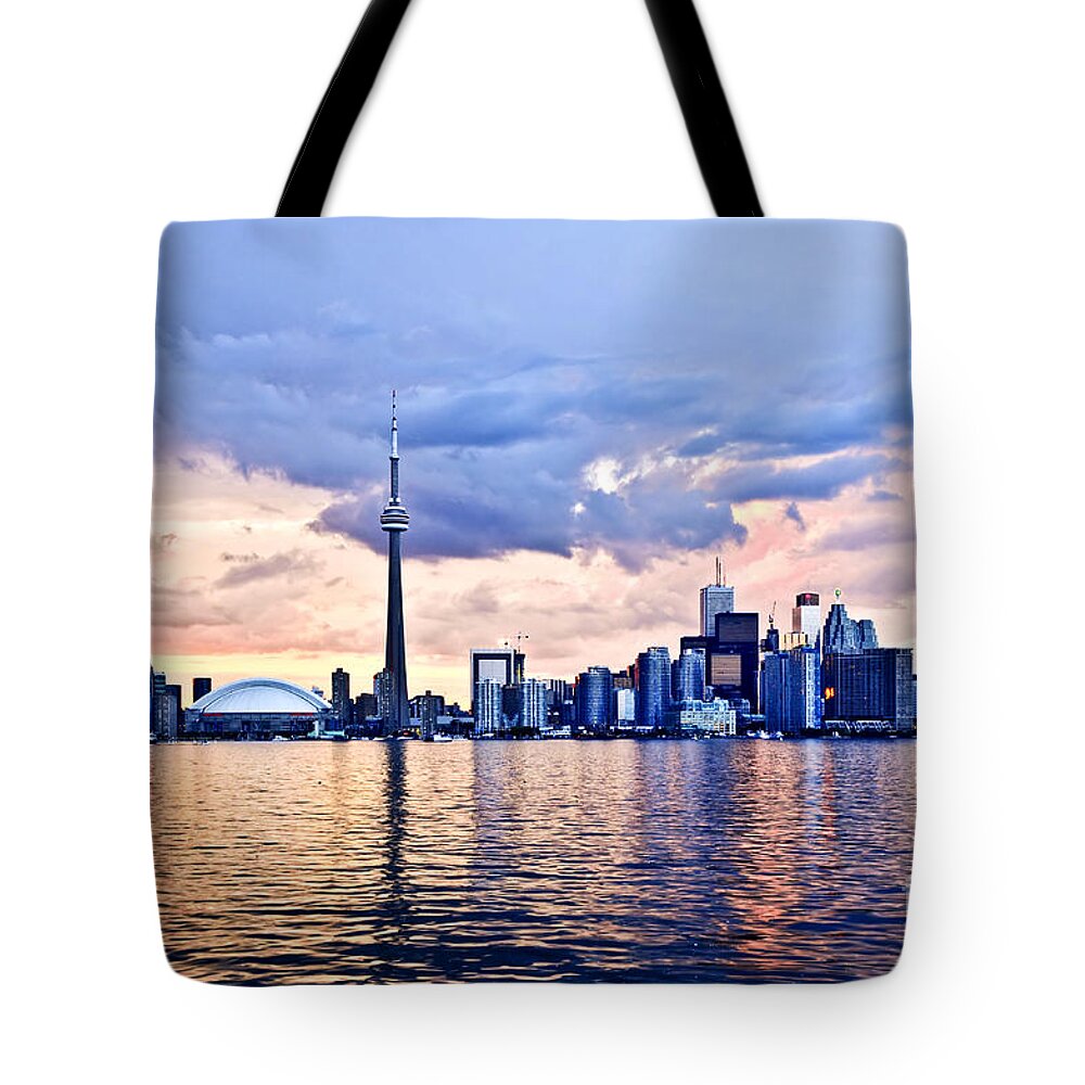 Toronto Tote Bag featuring the photograph Toronto skyline reflecting in Lake Ontario by Elena Elisseeva