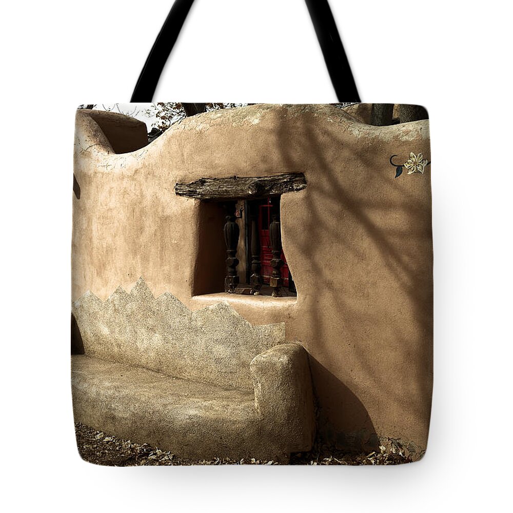 New Mexico Tote Bag featuring the photograph A bench in old town by Jeff Swan