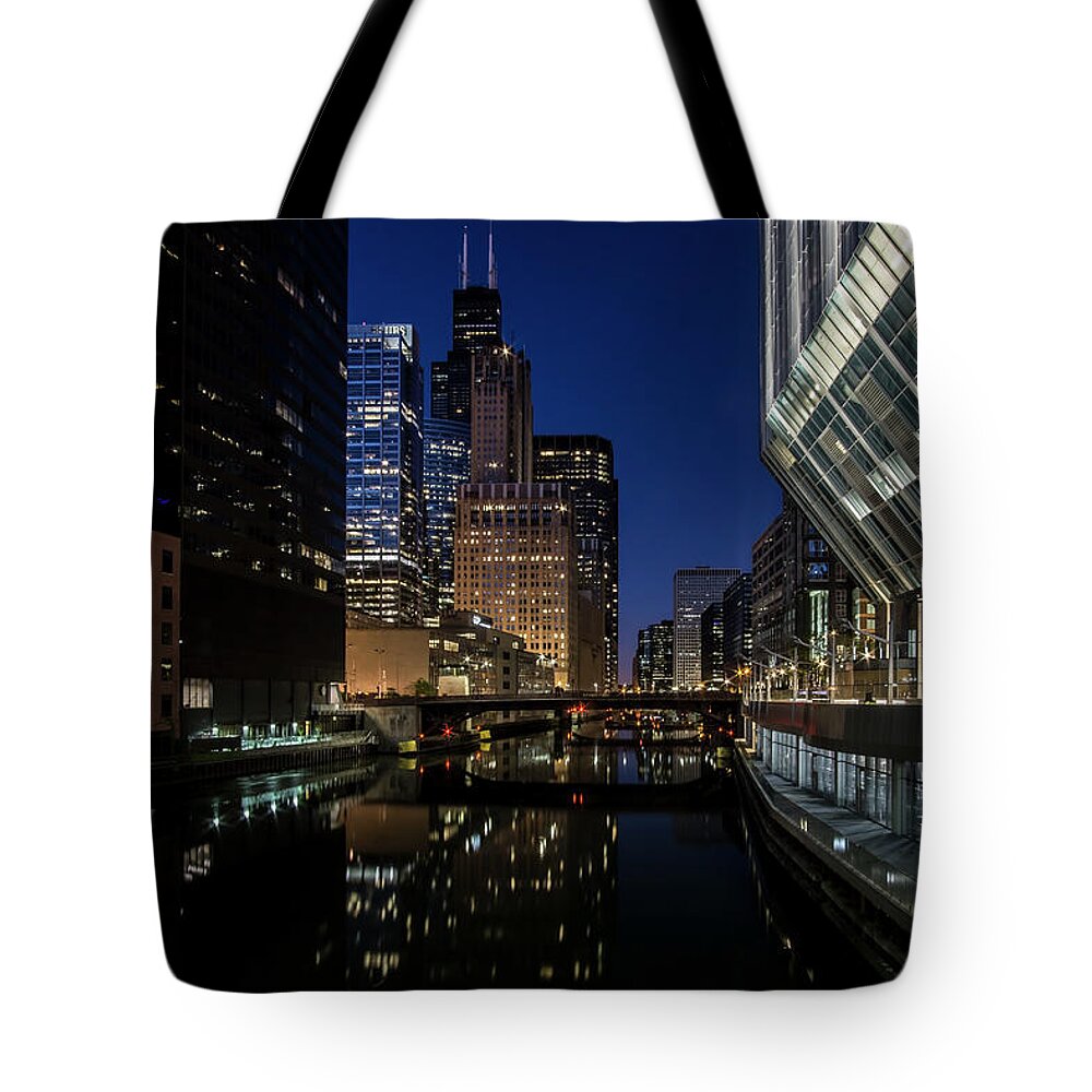 Chicago River Tote Bag featuring the photograph A Chicago River and Skyline at blue hour by Sven Brogren