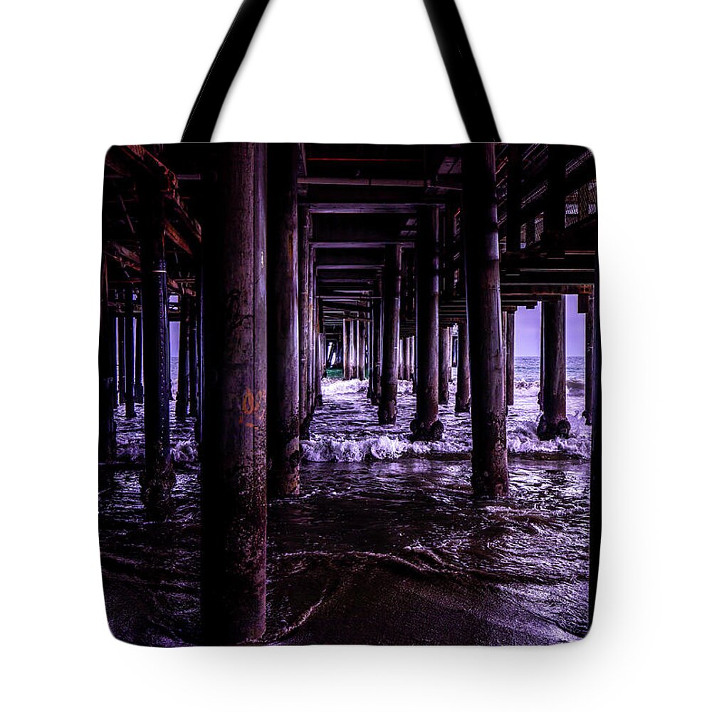 Under The Pier Tote Bag featuring the photograph A Cloudy Day Under The Pier by Gene Parks