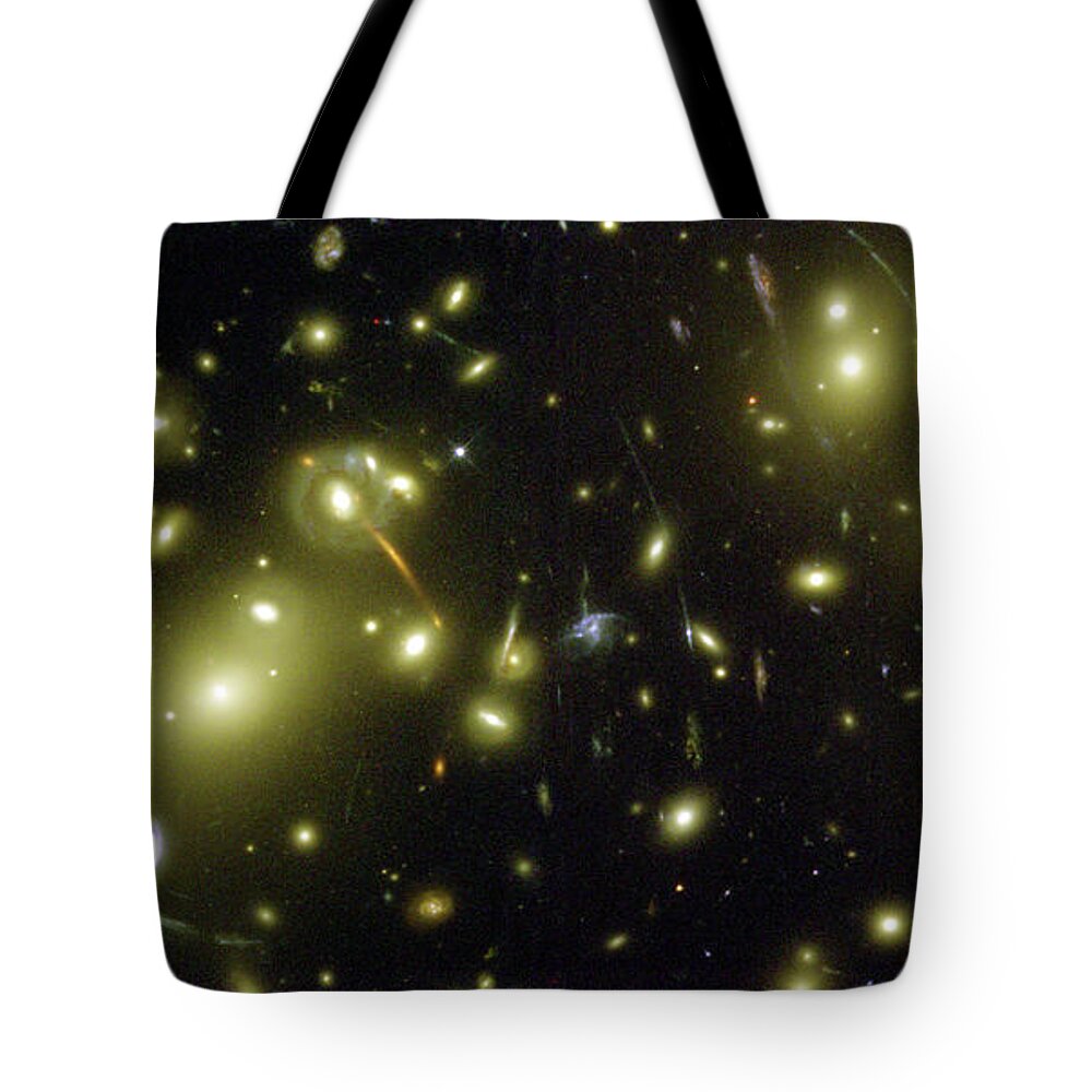 A Cosmic Magnifying Glass Hubble Space Telescope Center Image Tote Bag featuring the photograph A Cosmic Magnifying Glass Hubble Space Telescope Center Image by Paul Fearn
