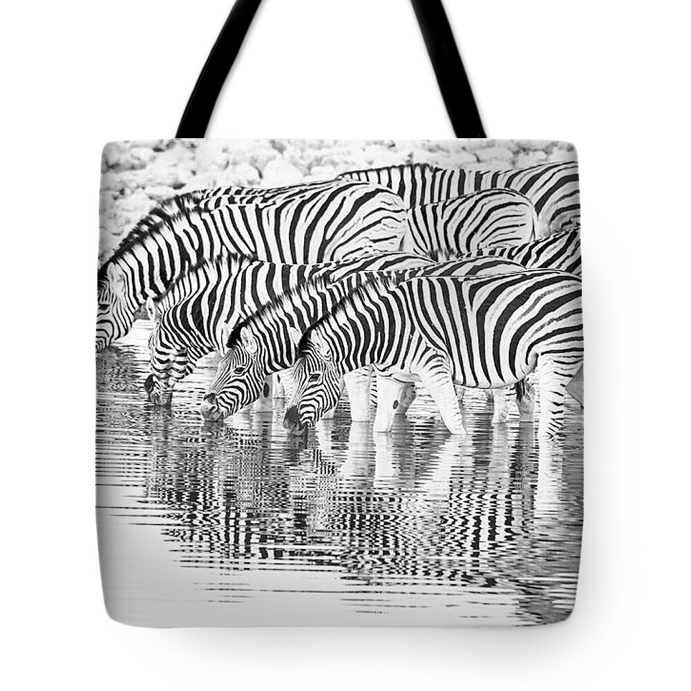 Africa Tote Bag featuring the photograph A family that drinks together. by Usha Peddamatham