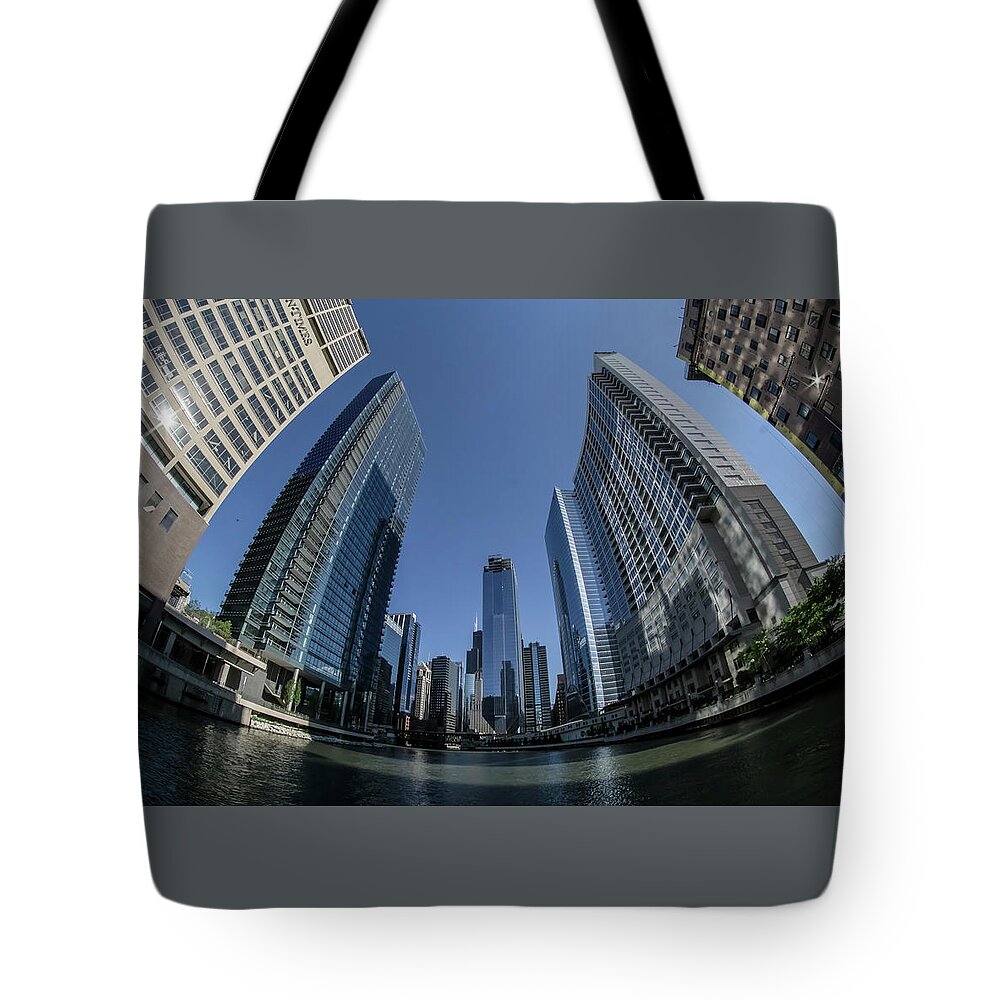 Sun Times Building Tote Bag featuring the photograph A fisheye view of the Chicago skyline as you appraoch wolf point by Sven Brogren