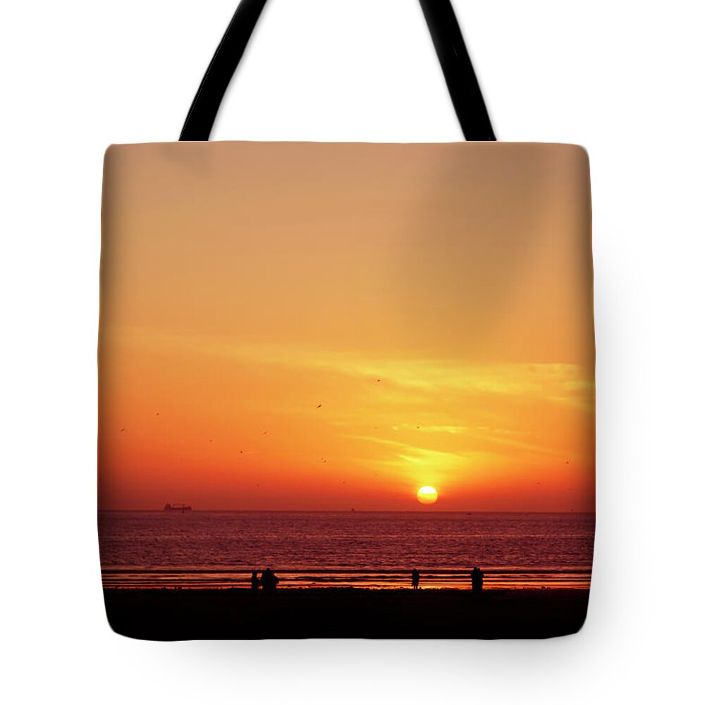 Africa Tote Bag featuring the photograph A gorgeous sundown with view to the sea by Gina Koch