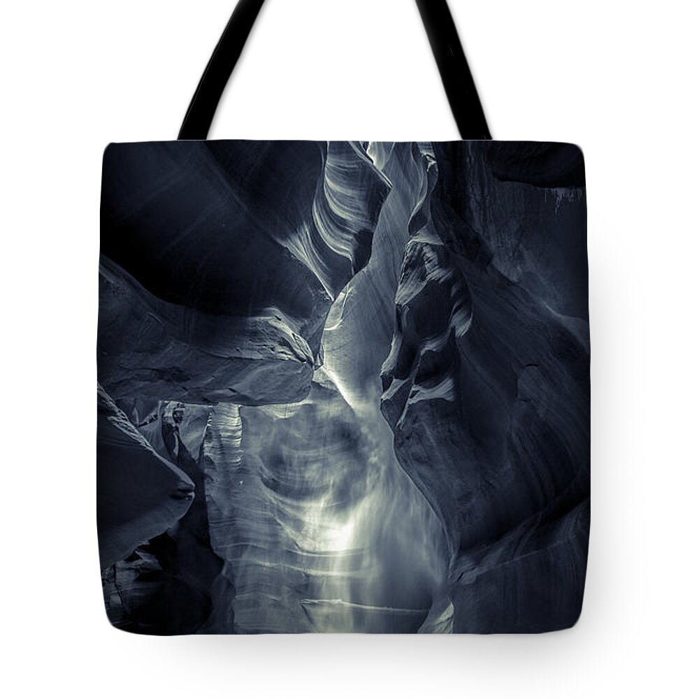 Phantom Tote Bag featuring the photograph A Phantom Emerges from Antelope Canyon by Jim DeLillo