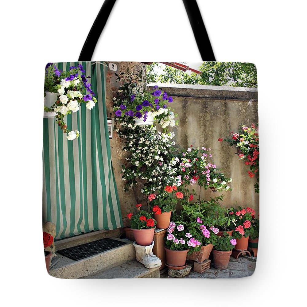 Tuscany Tote Bag featuring the photograph A quiet street, and its spring. by Jacci Freimond Rudling