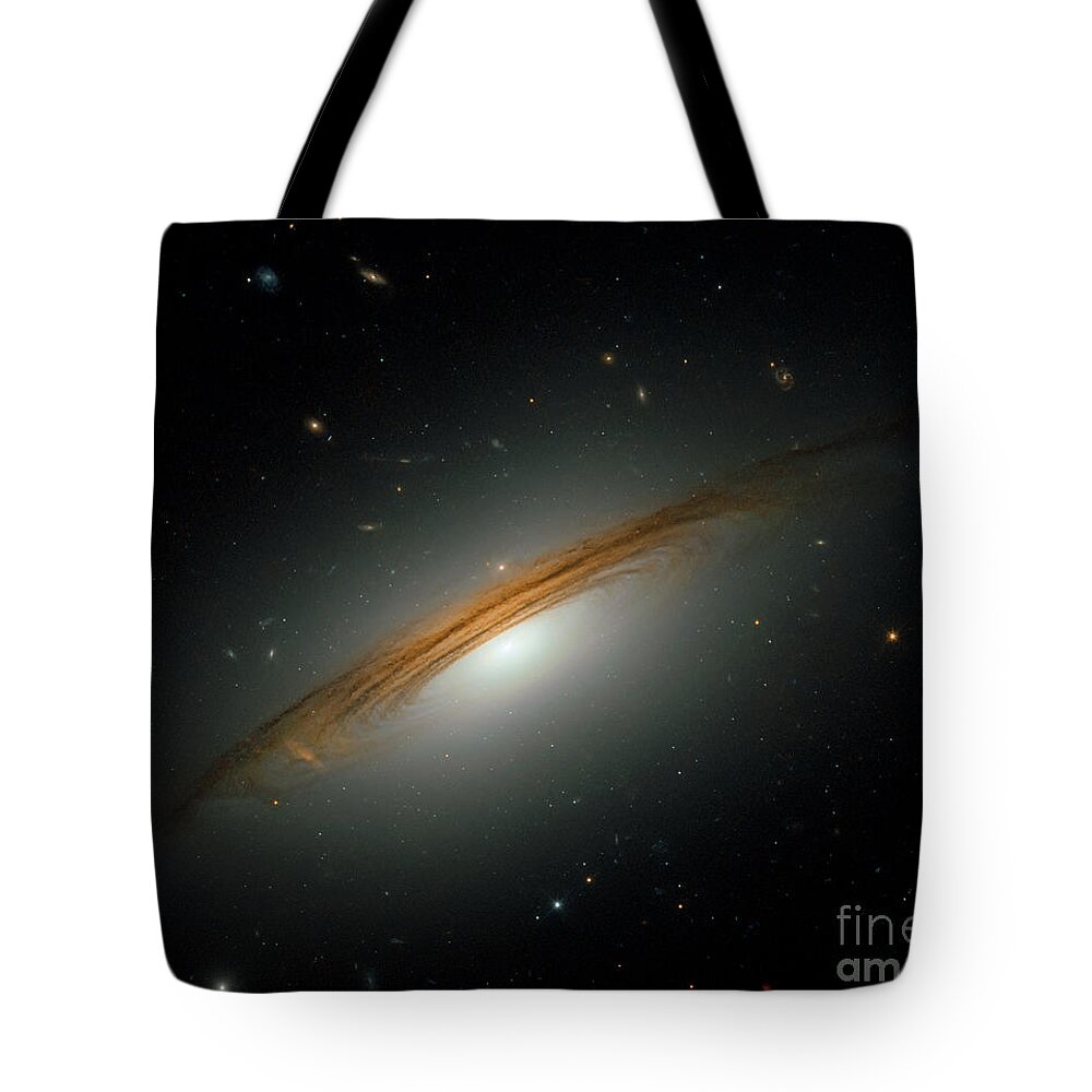 Galaxy Tote Bag featuring the photograph Fastest spinning galaxy by Nicholas Burningham