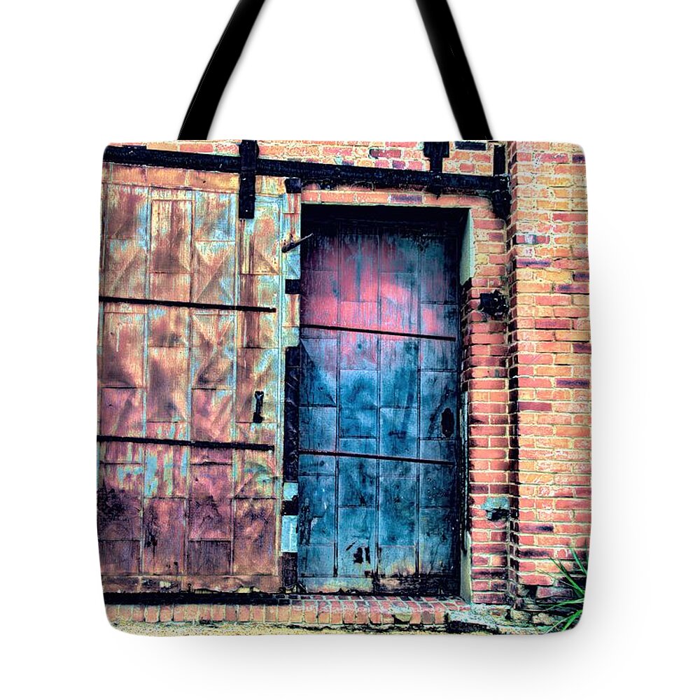 Diana Mary Sharpton Photography Tote Bag featuring the photograph A Rusty Loading Dock Door by Diana Mary Sharpton