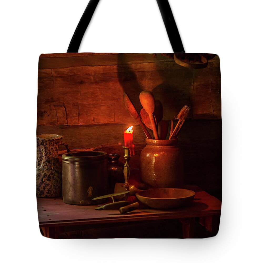 Log Cabin Tote Bag featuring the photograph A Single Candle by Randall Evans