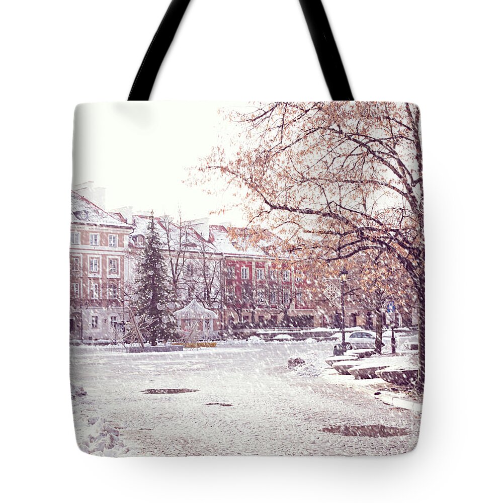 Architecture Tote Bag featuring the photograph A street in Warsaw, Poland on a snowy day by Juli Scalzi