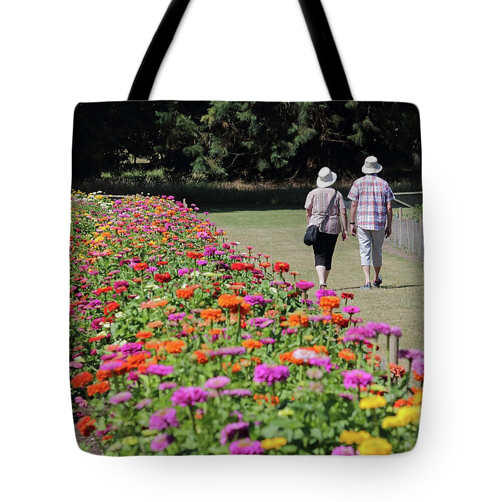 A Stroll In The Garden Wisley Uk Pretty Flowers Tote Bag featuring the photograph A stroll in the garden by Julia Gavin