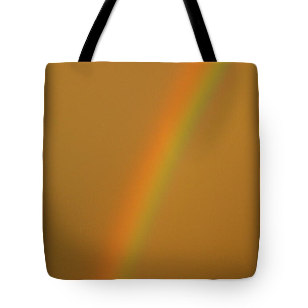 Rainbow Tote Bag featuring the photograph A Sunset Rainbow by Diana Hatcher