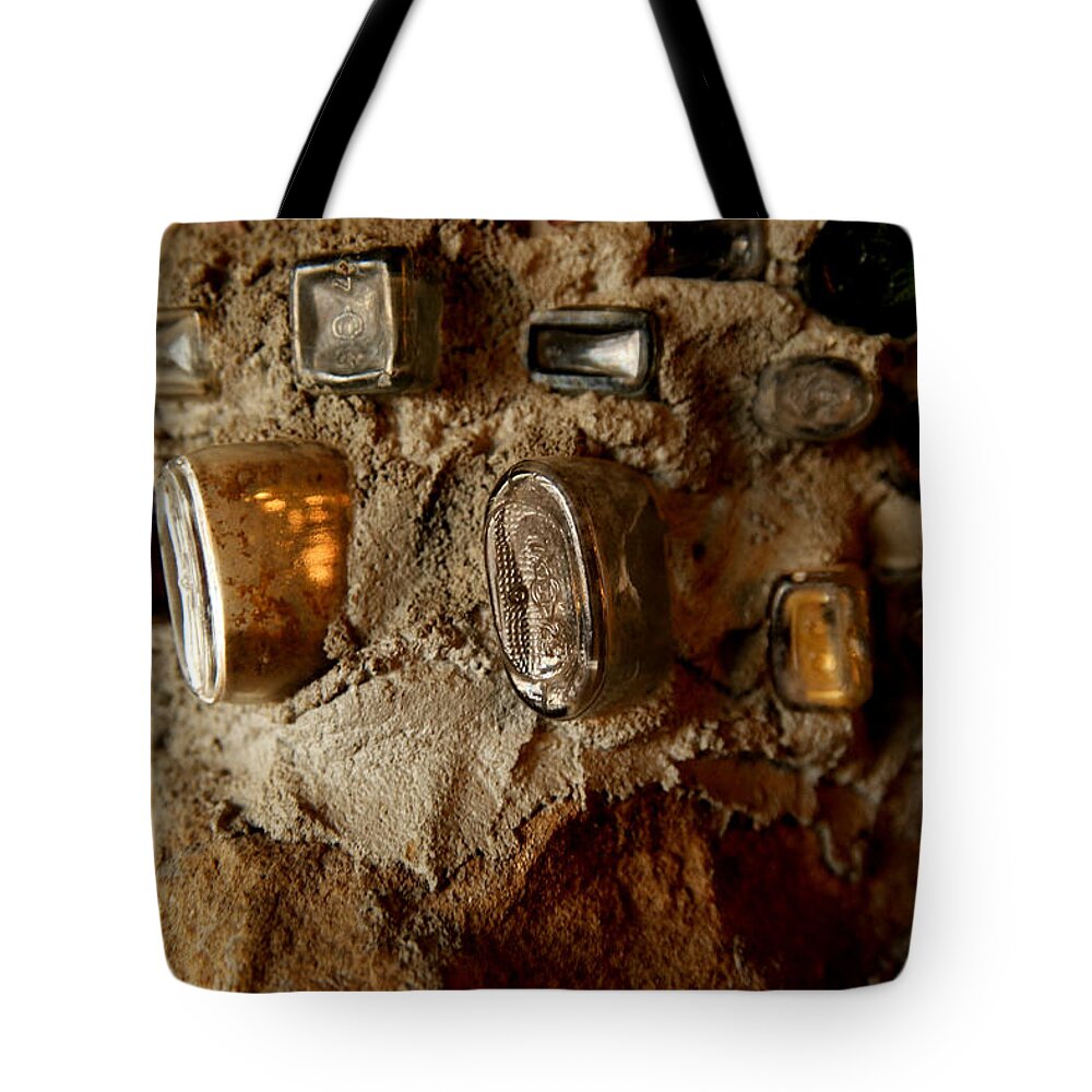 Art Tote Bag featuring the photograph A wall of bottles by Jeff Swan