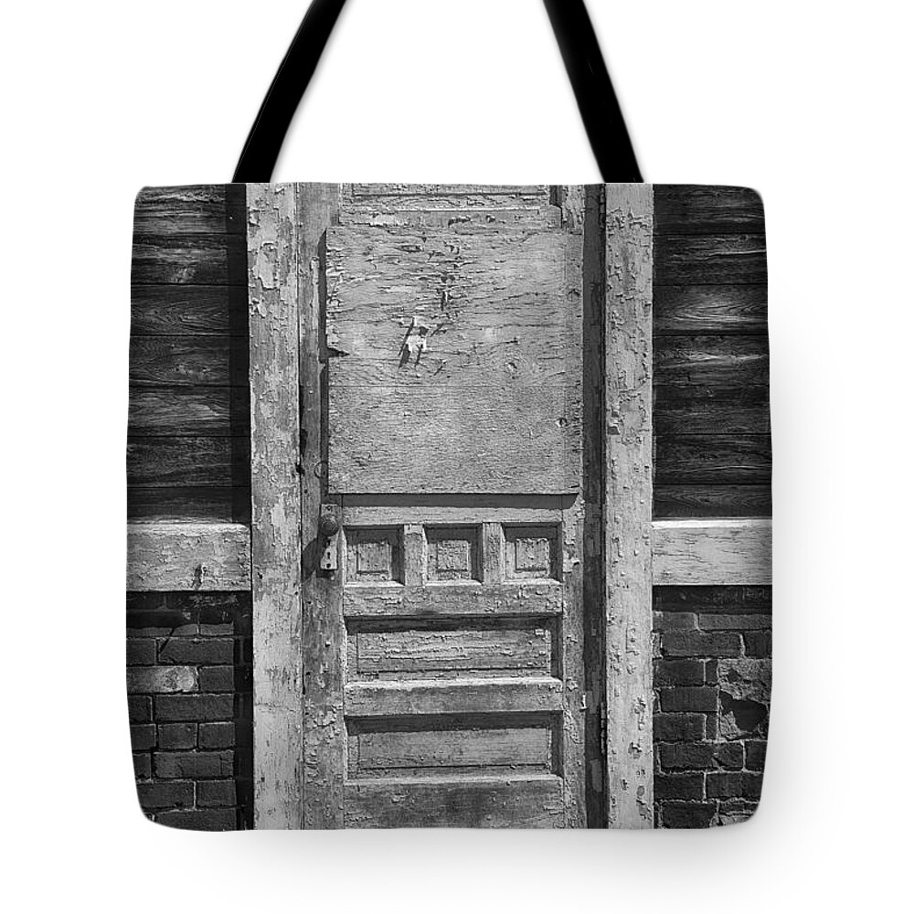 Door Tote Bag featuring the photograph A Well Used Door by Dick Pratt